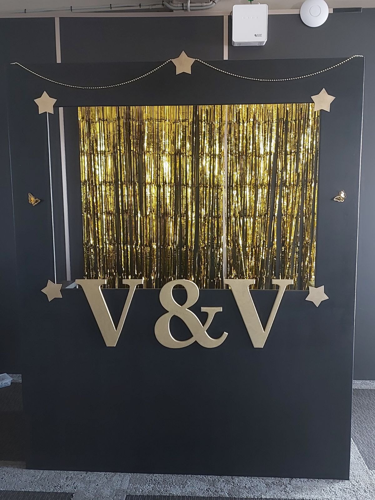 Black and gold custom event backdrop with oversized lettering